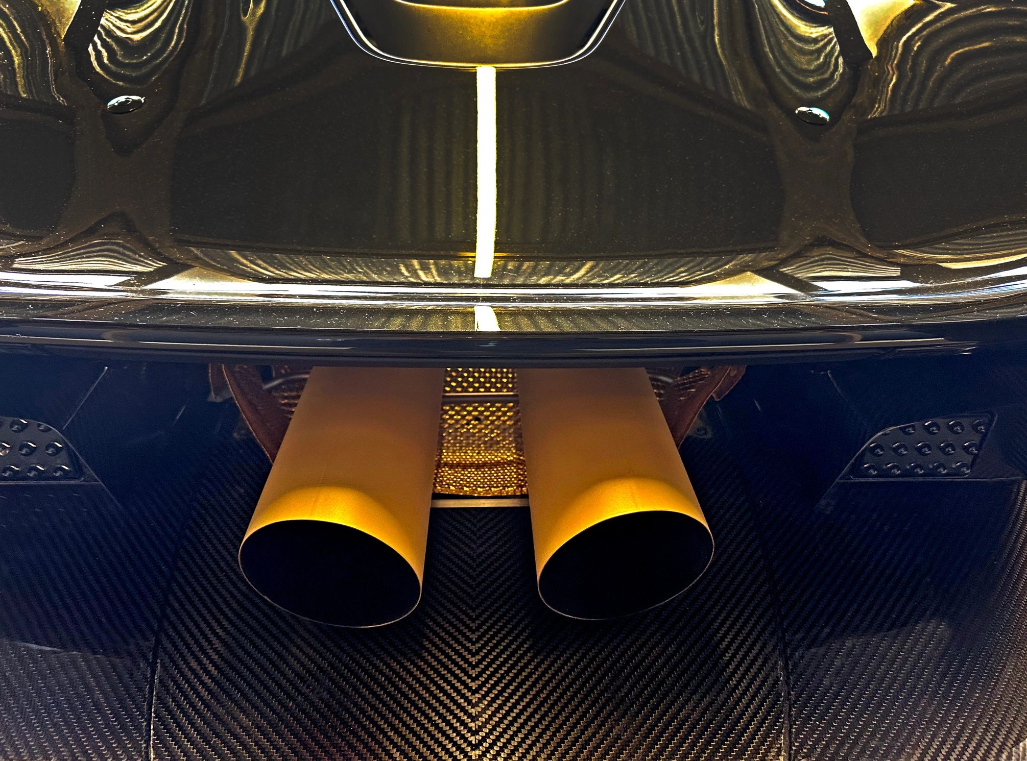 Twin exhaust pipes and diffuser detail on a hypercar